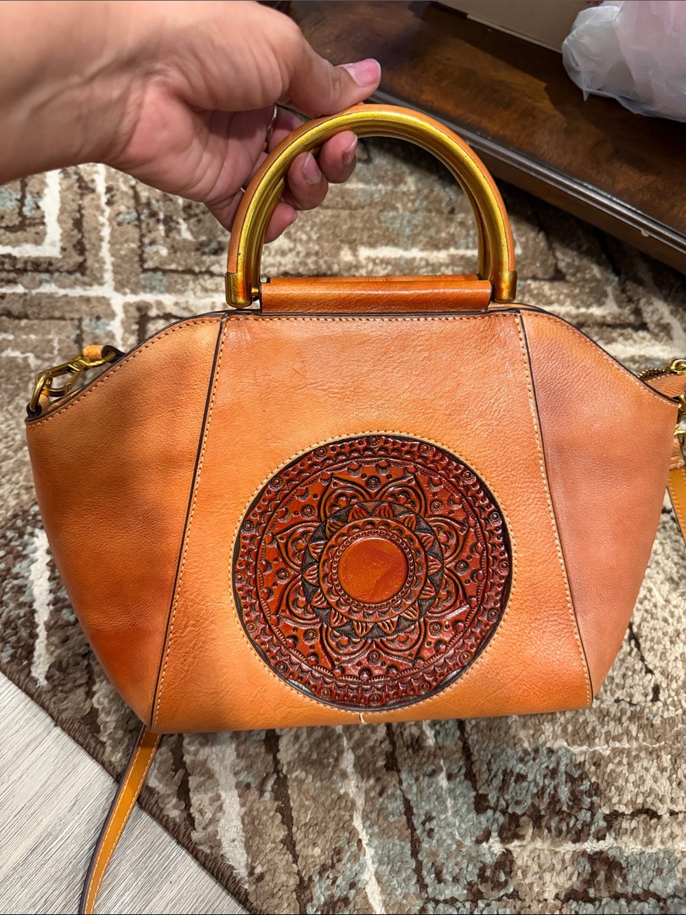 Source Unknown Orange Leather Satchel with Embossed Medallion and Gold Handles